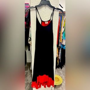 Black spaghetti strap dress with red underlay. S/M